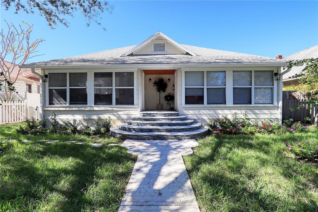 front view of a house with a yard