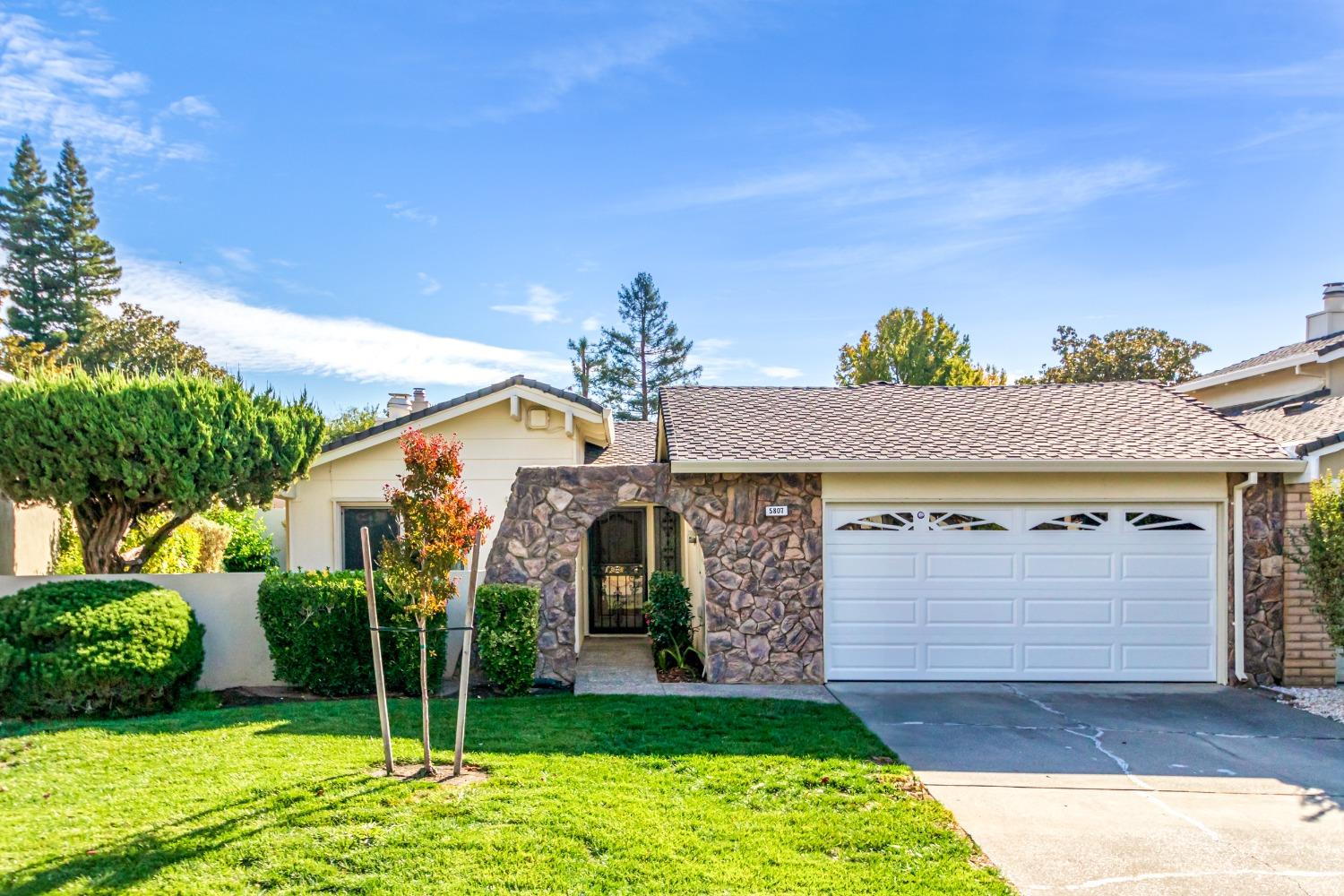 a front view of a house with garden