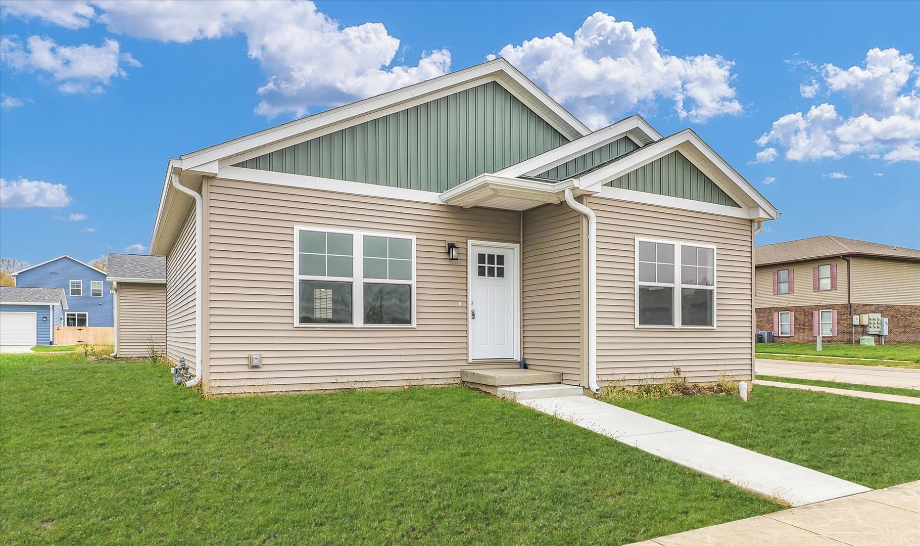 a front view of a house with a yard