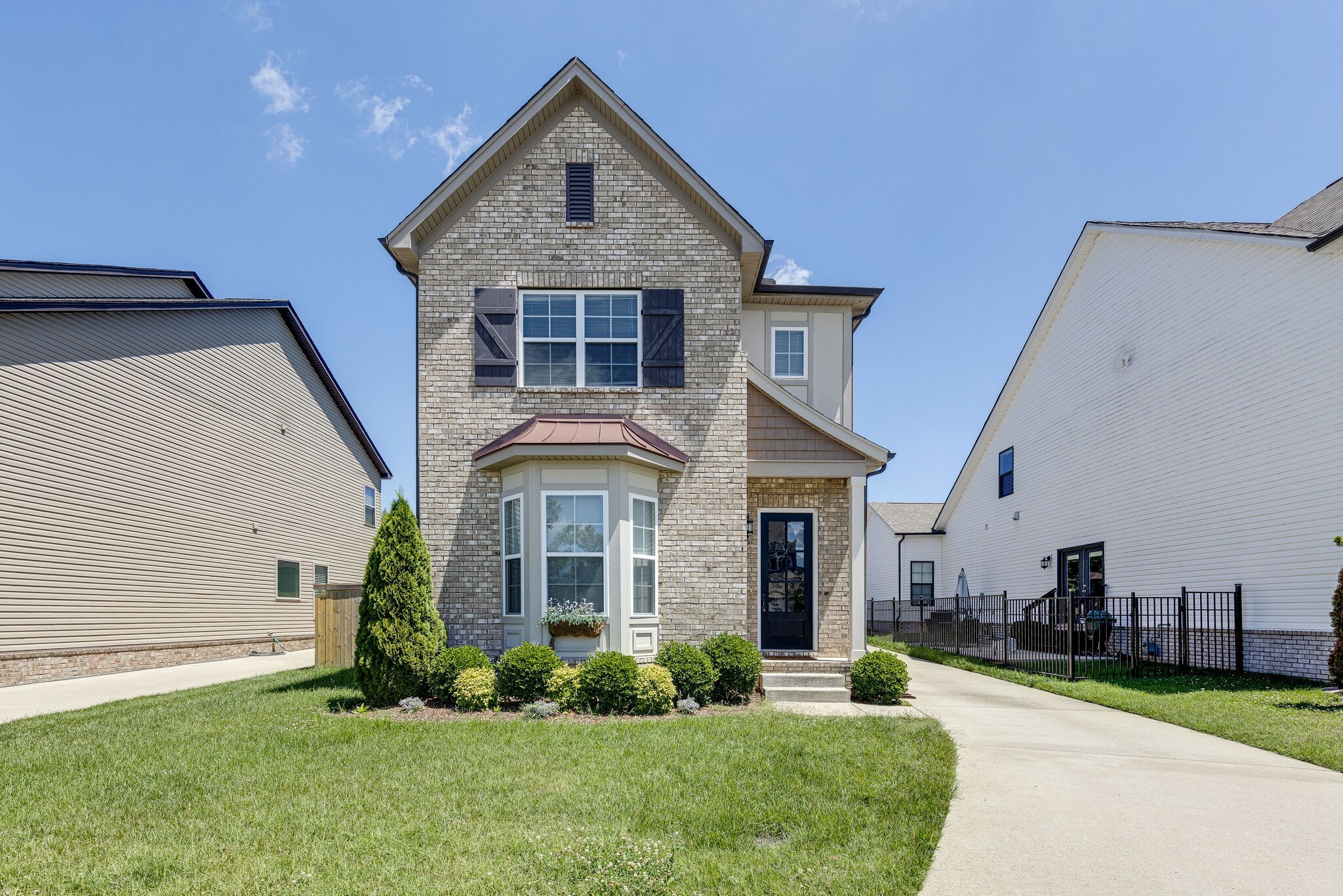 a front view of a house with a yard