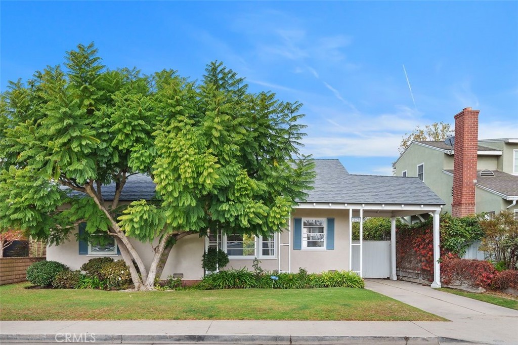 front view of a house with a garden