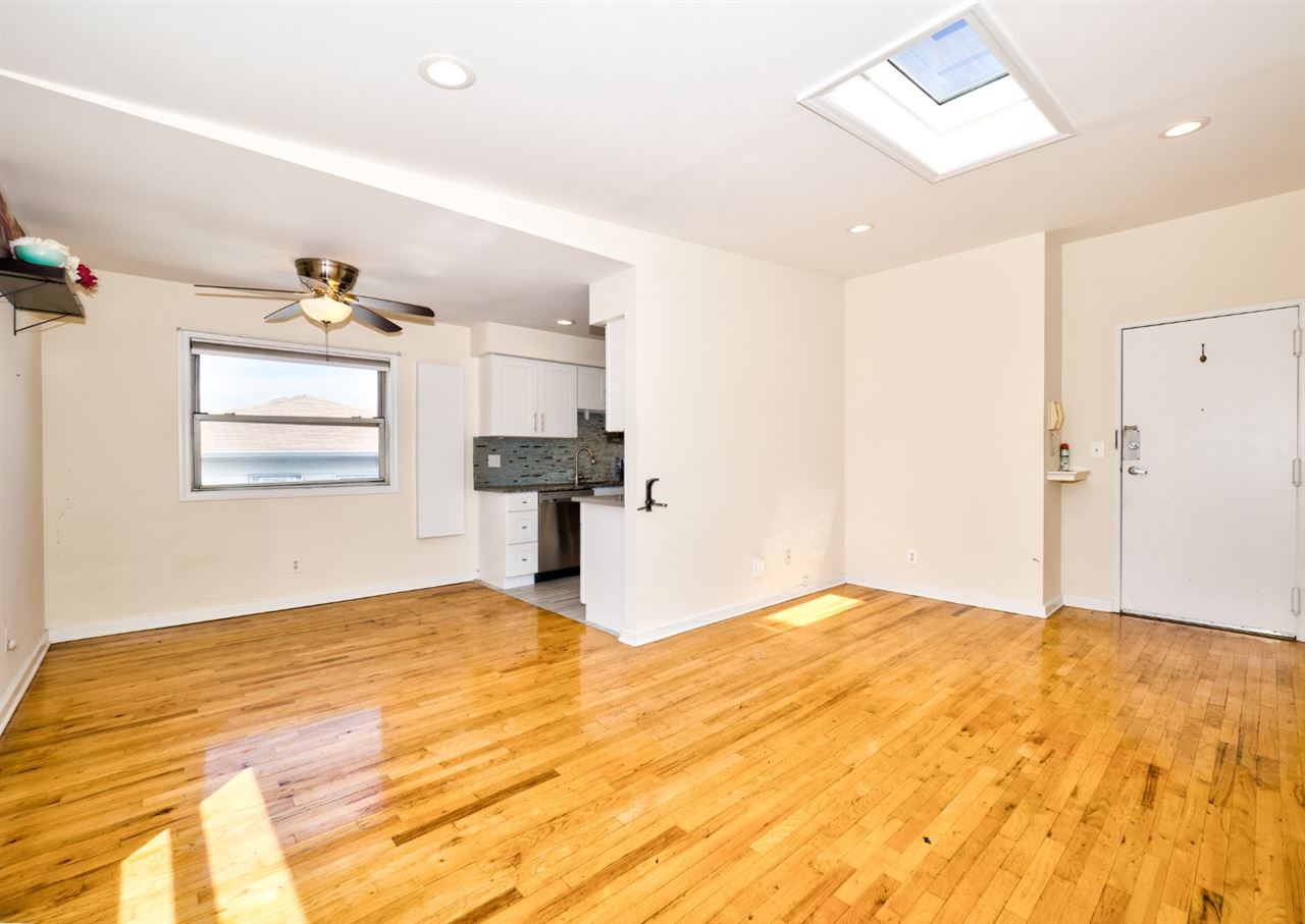 a view of an empty room with a window