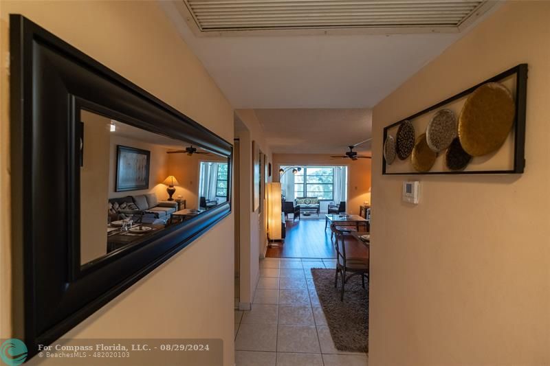 a view of a hallway with seating area