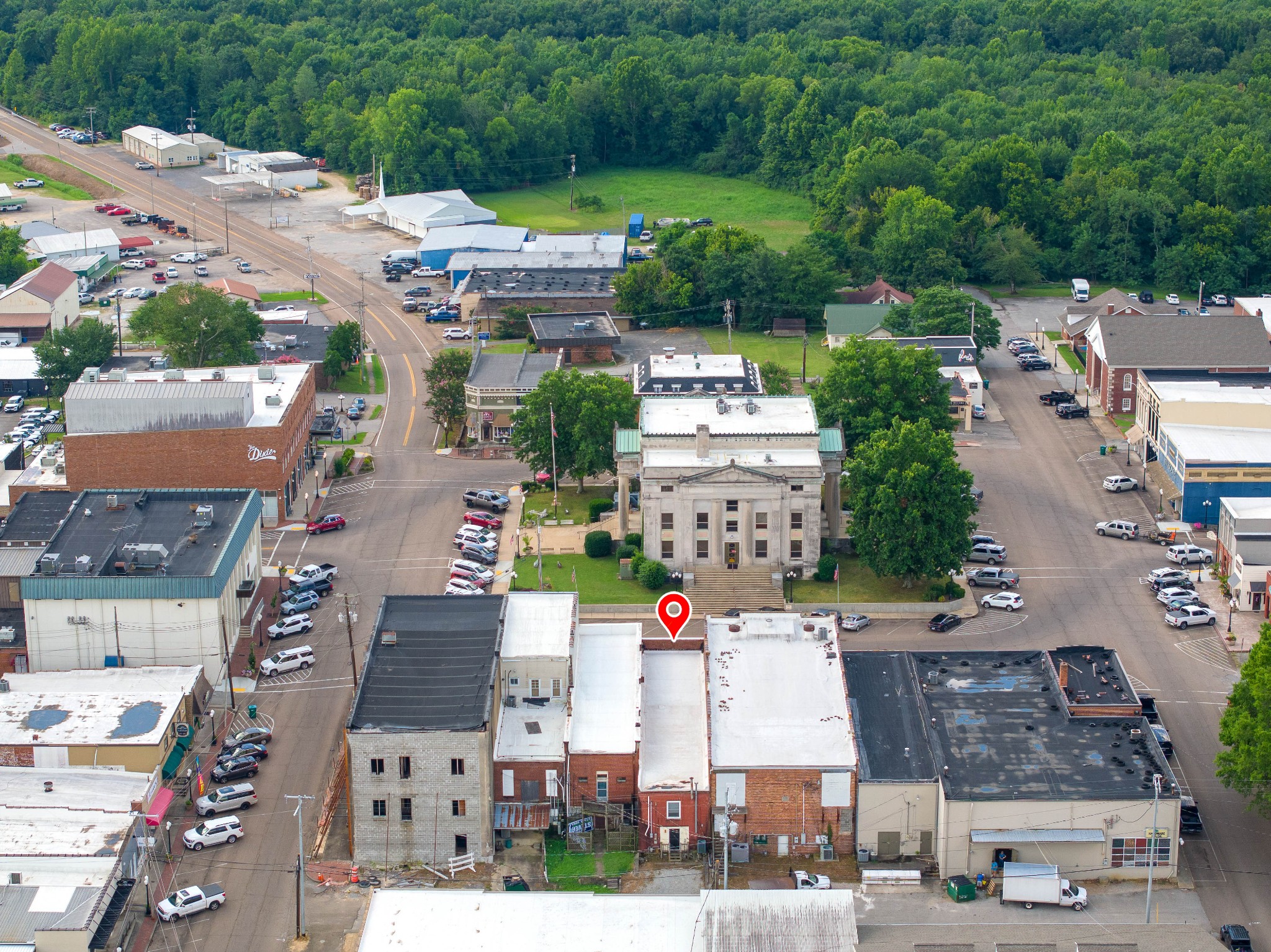 an aerial view of multiple houses with yard