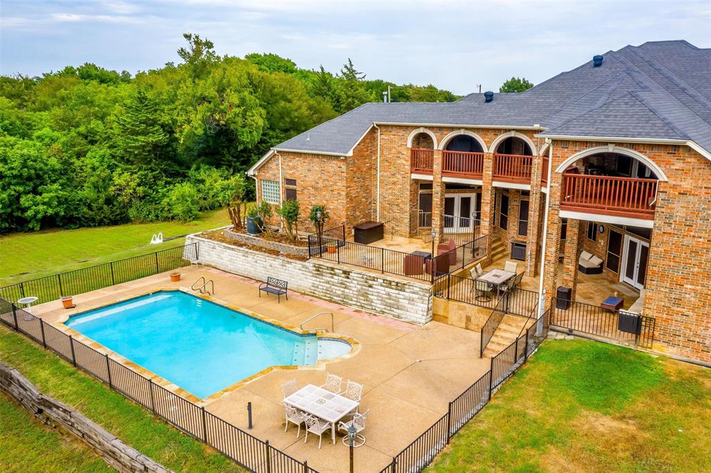 a view of a swimming pool with a garden