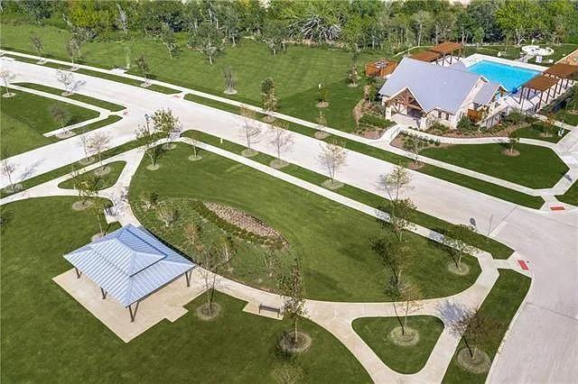 a view of a swimming pool with a yard