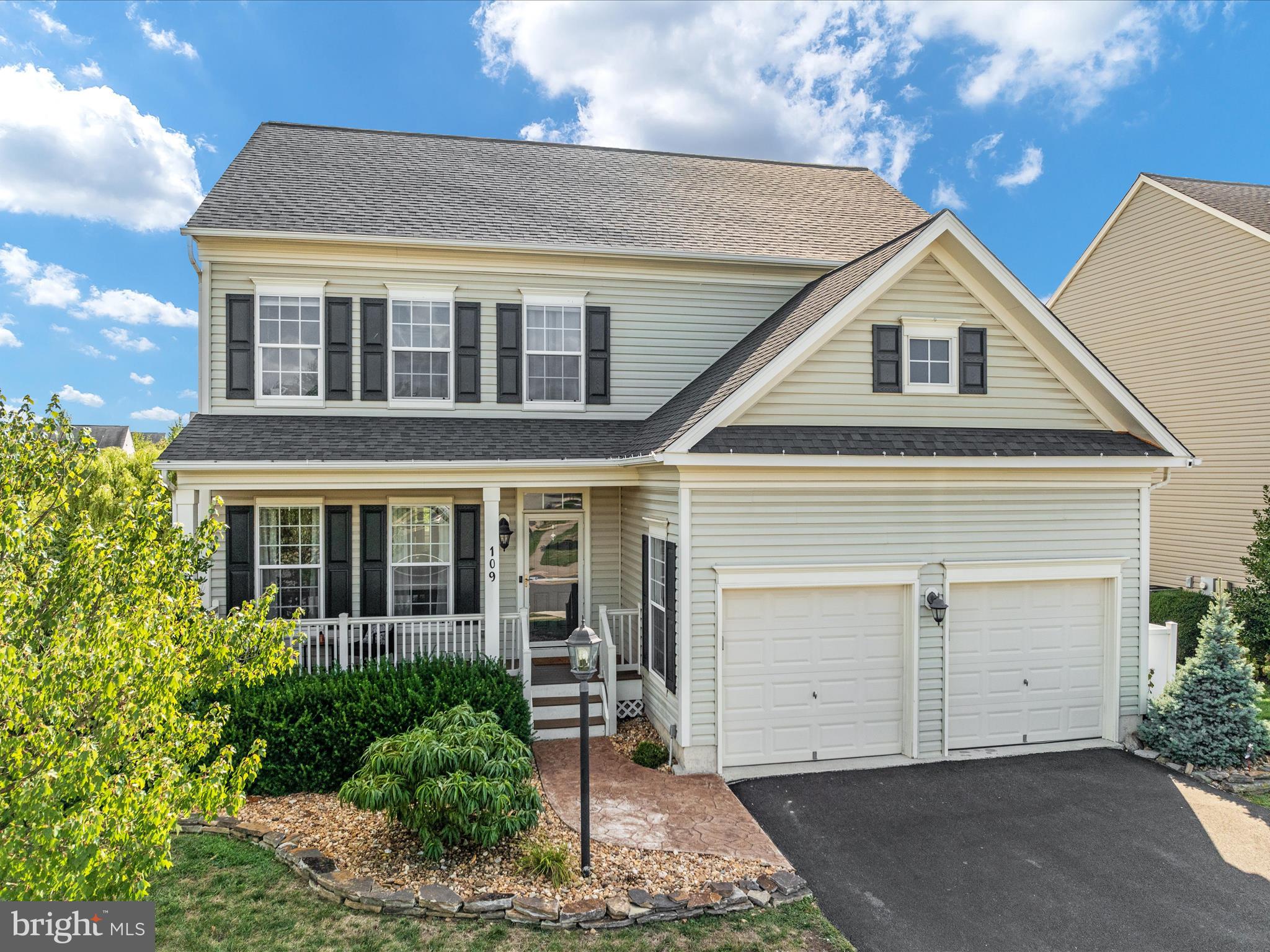 a front view of a house with a garage