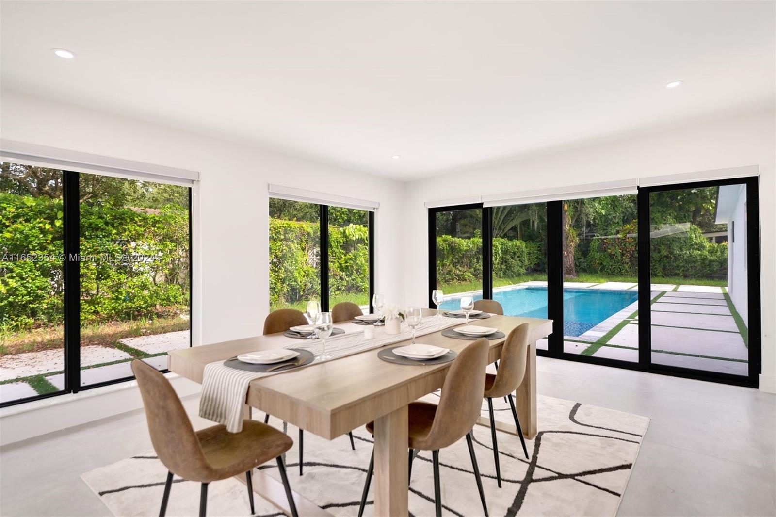 a view of a dining room with furniture window and outside view