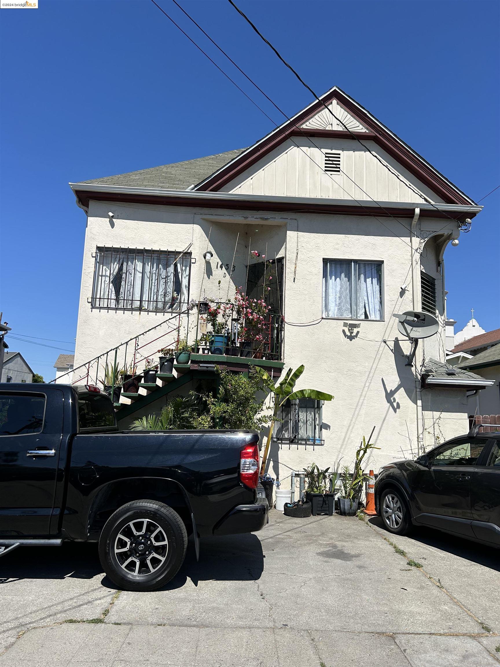 a front view of a house with parking space