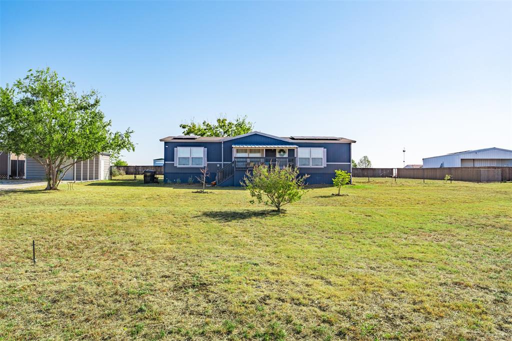 a view of a house with a big yard