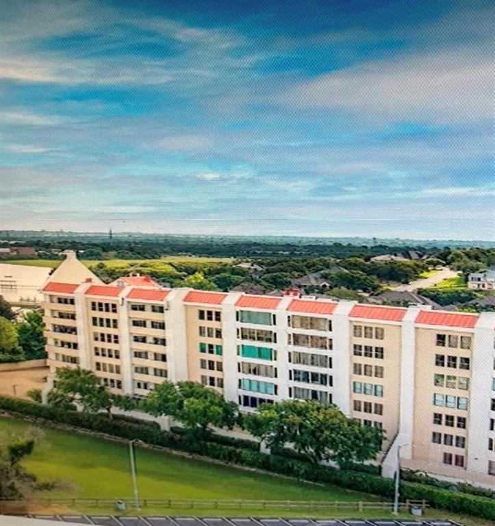 a view of building with lake view and tall building