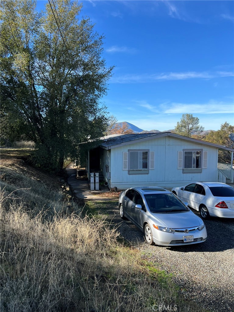 a front view of house with yard and seating space