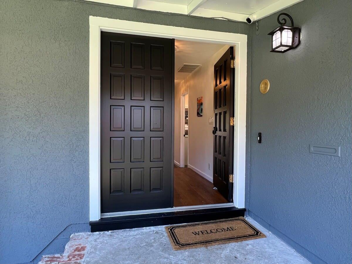 an entryway with wooden floor