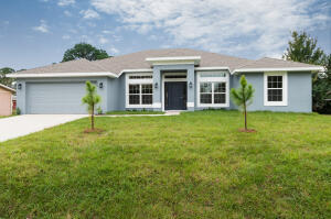 front view of a house with a yard