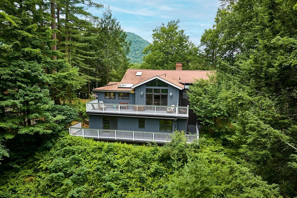 an aerial view of a house with a balcony