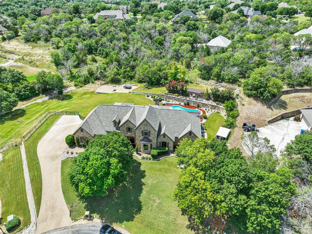 an aerial view of a house with yard swimming pool and outdoor seating