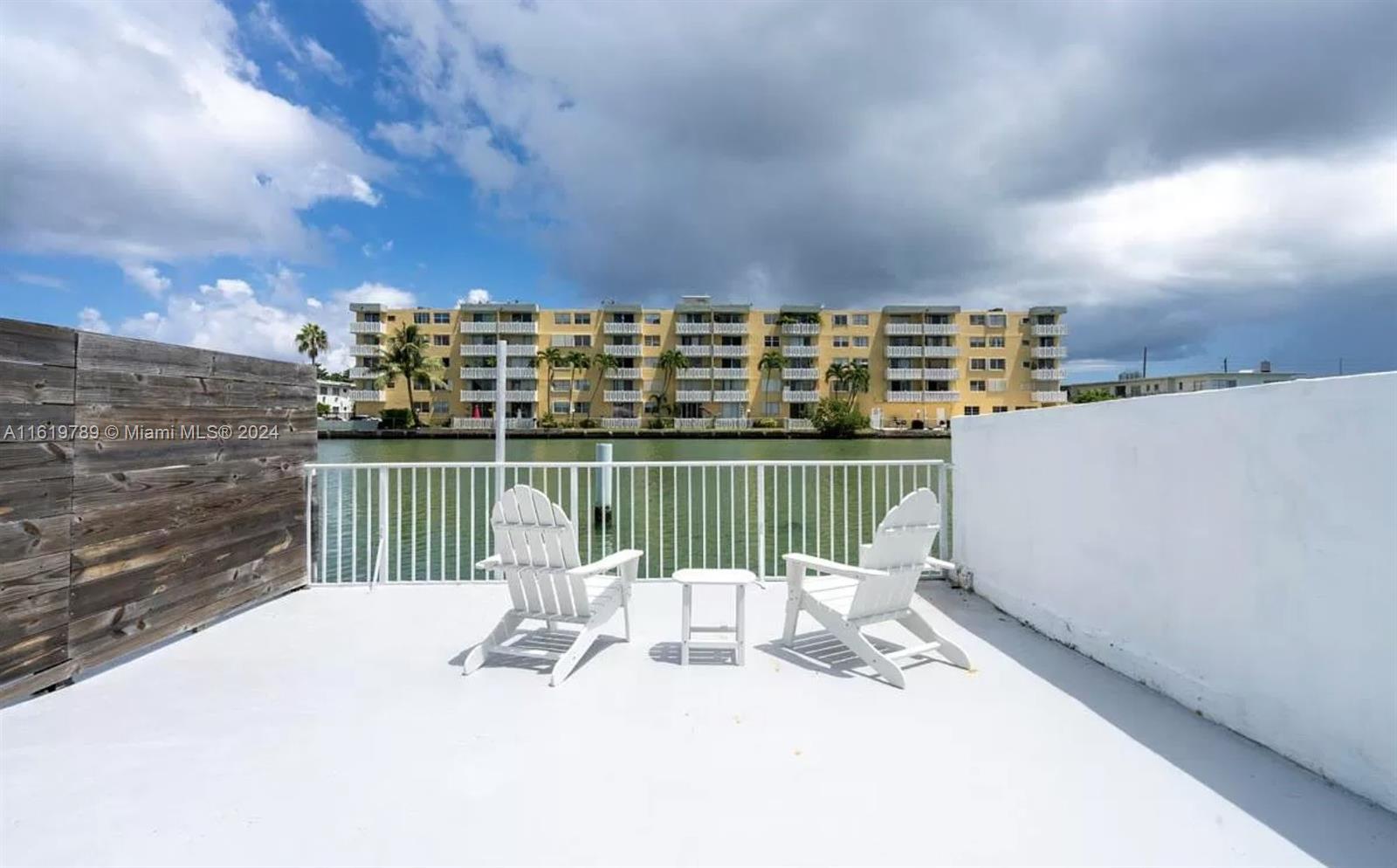 a view of a balcony with wooden floor