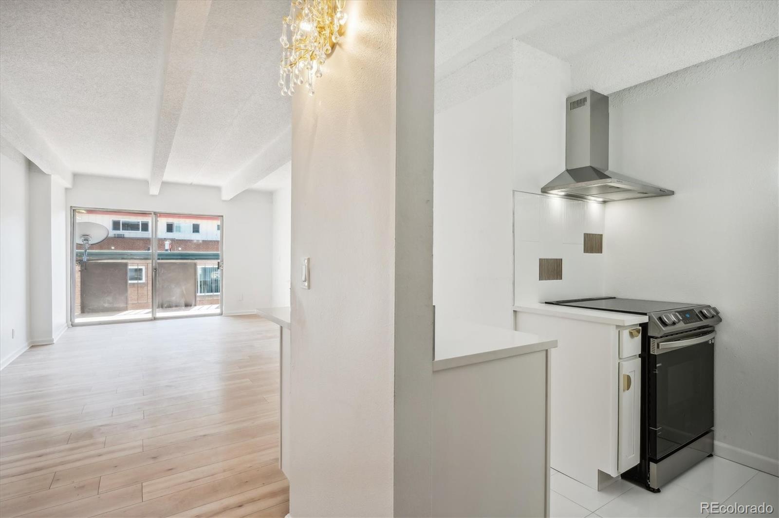 a kitchen with a stove and a refrigerator