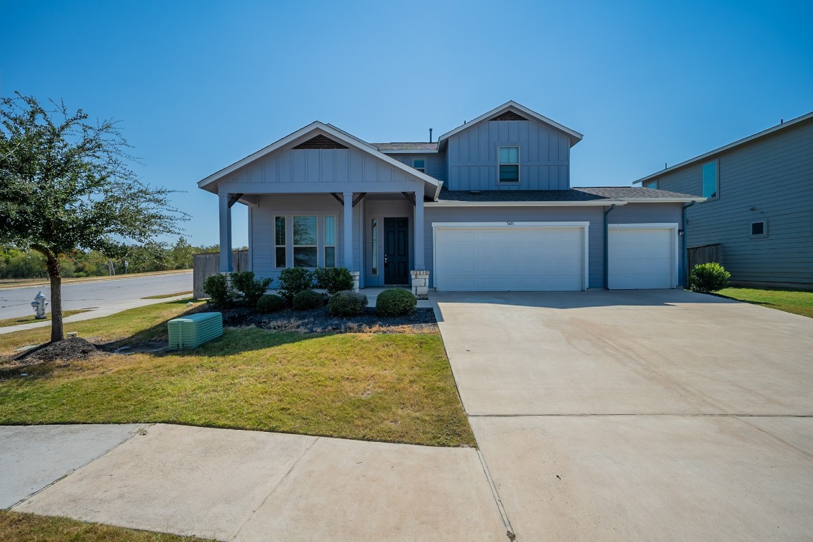 a front view of a house with yard