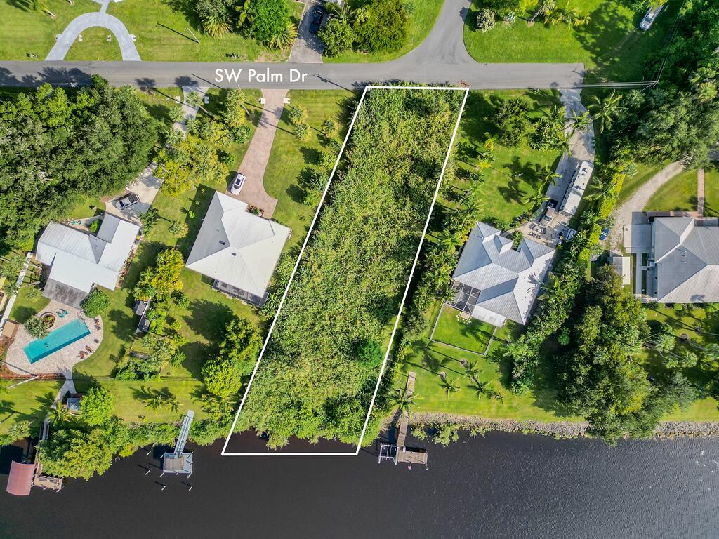 an aerial view of a house with a garden and plants