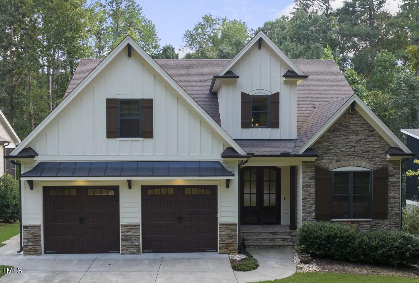 a front view of a house with a garage