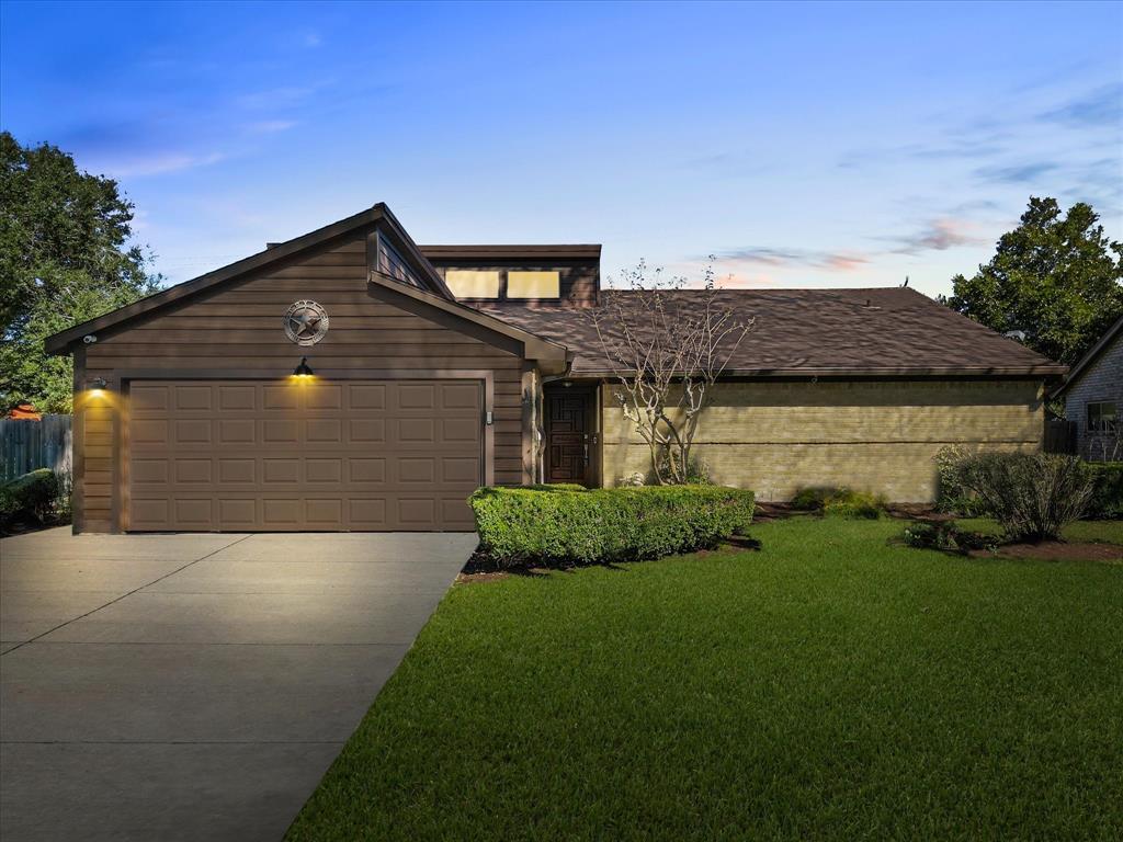 Welcome to this charming home, featuring a beautifully landscaped front yard and a welcoming entryway