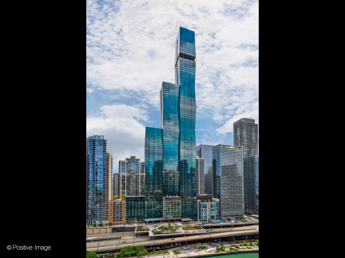 a view of a city from a corridor