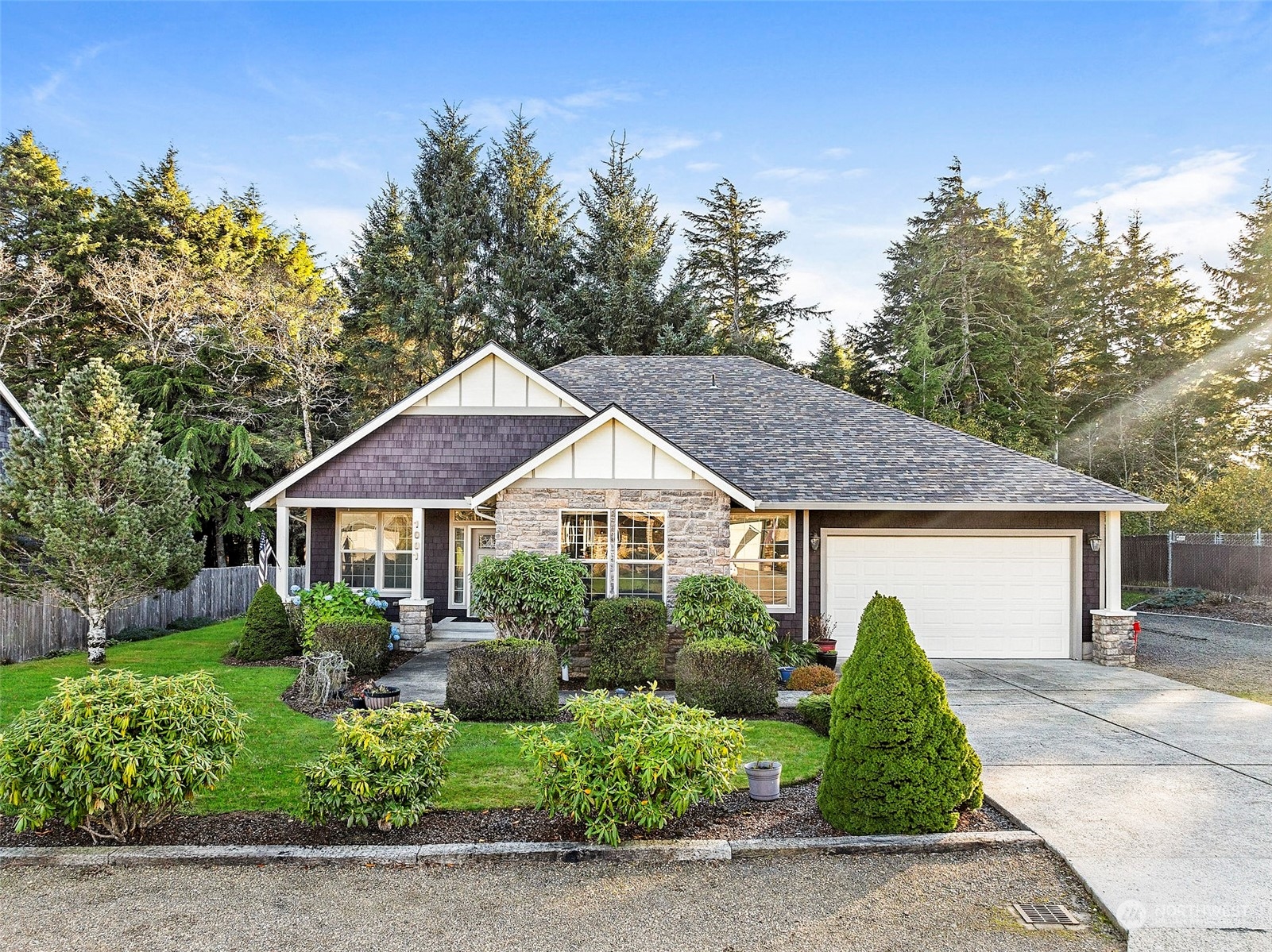 a front view of a house with a garden