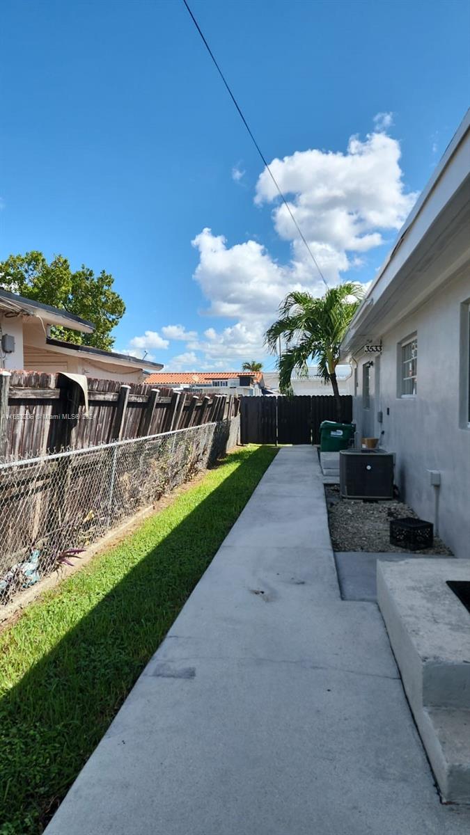 a view of a backyard with sitting area