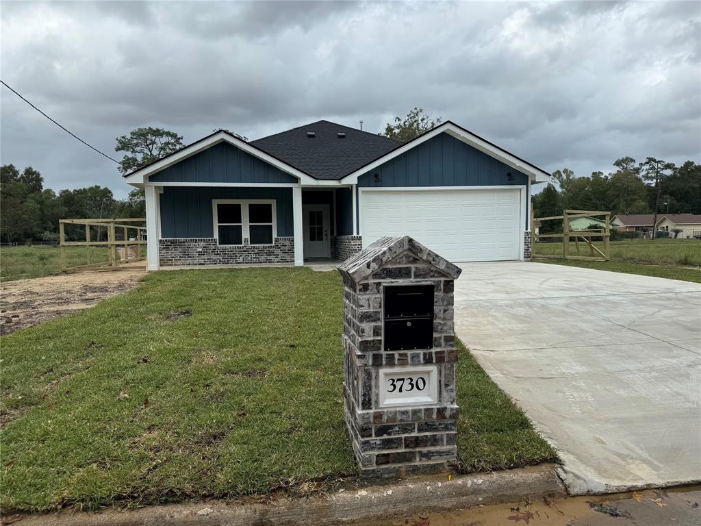 a front view of a house with yard