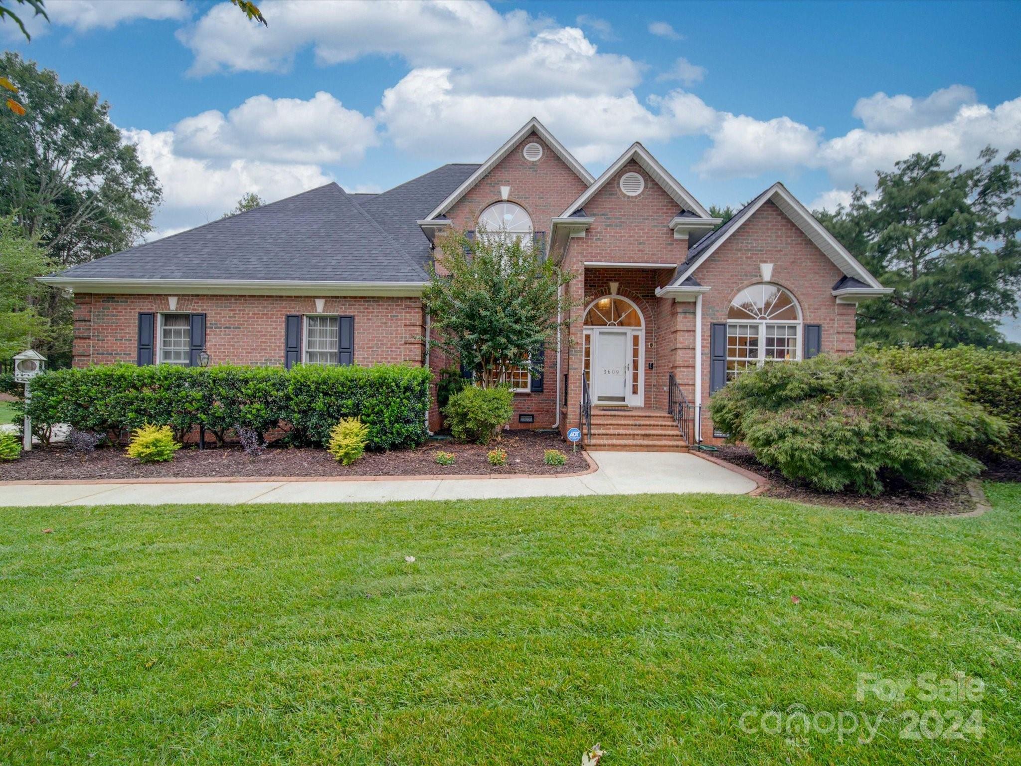 front view of a house with a yard