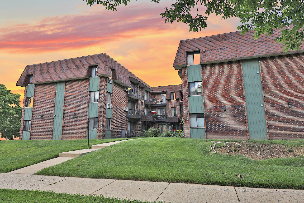 a brick building with a yard