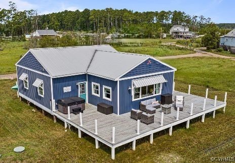 a aerial view of a house with a yard table and chairs