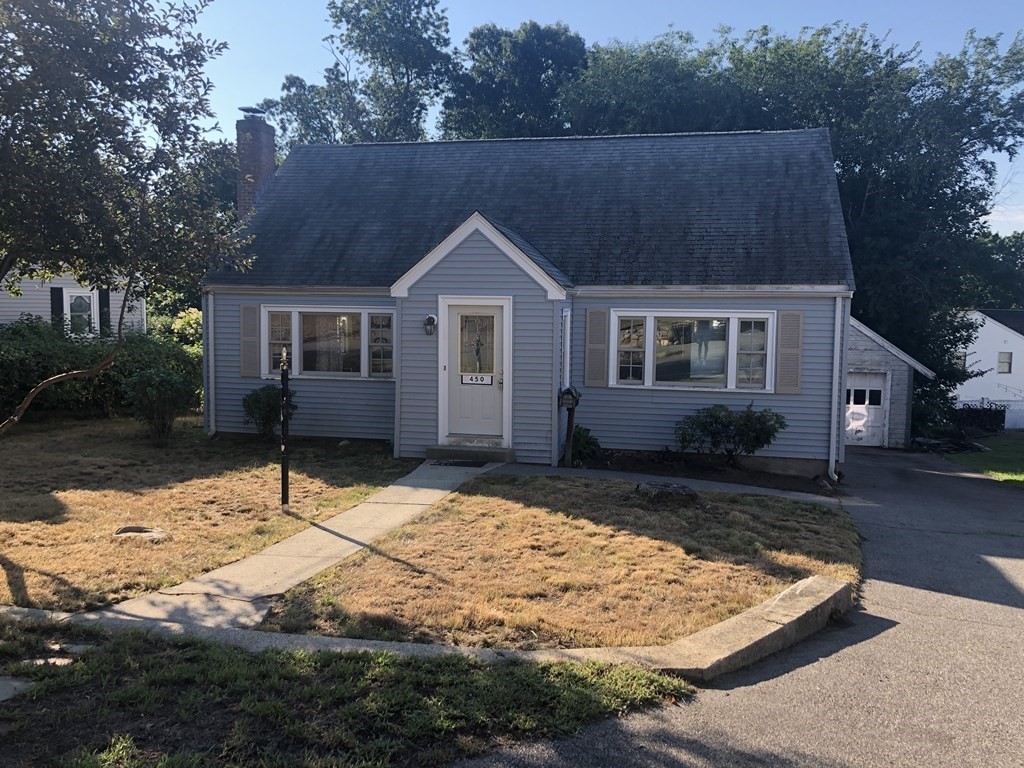 a house with trees in the background