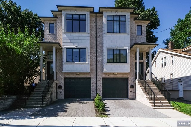 a front view of a house with yard