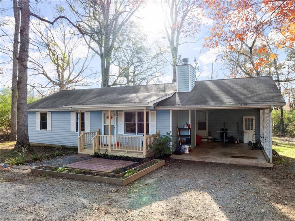 a front view of a house with yard patio and fire pit