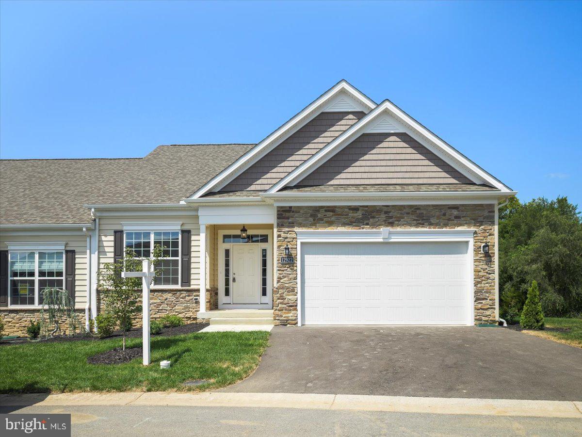 a front view of a house with a garage