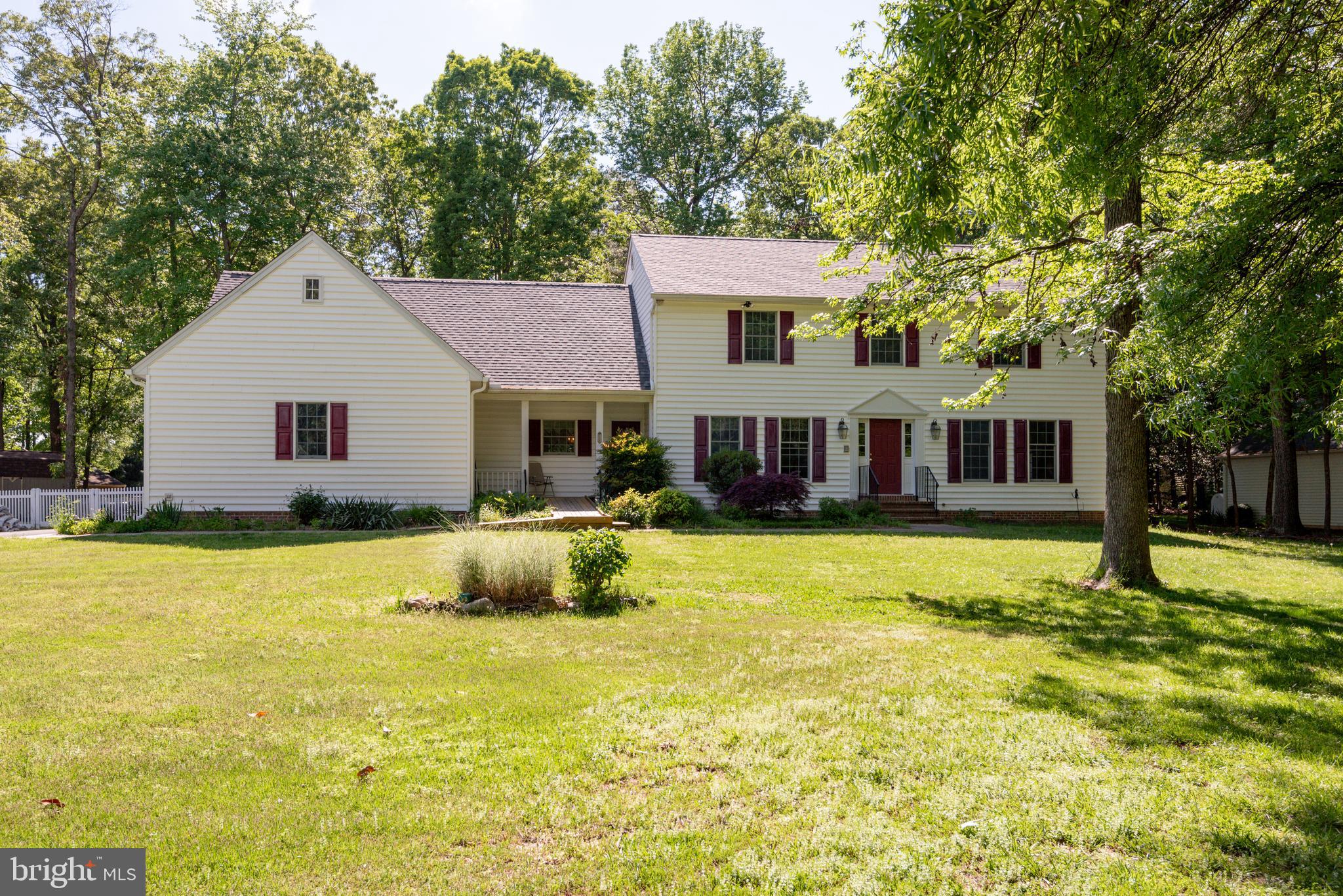 a front view of a house with a yard outdoor seating and yard