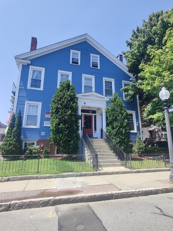 front view of a house with a yard