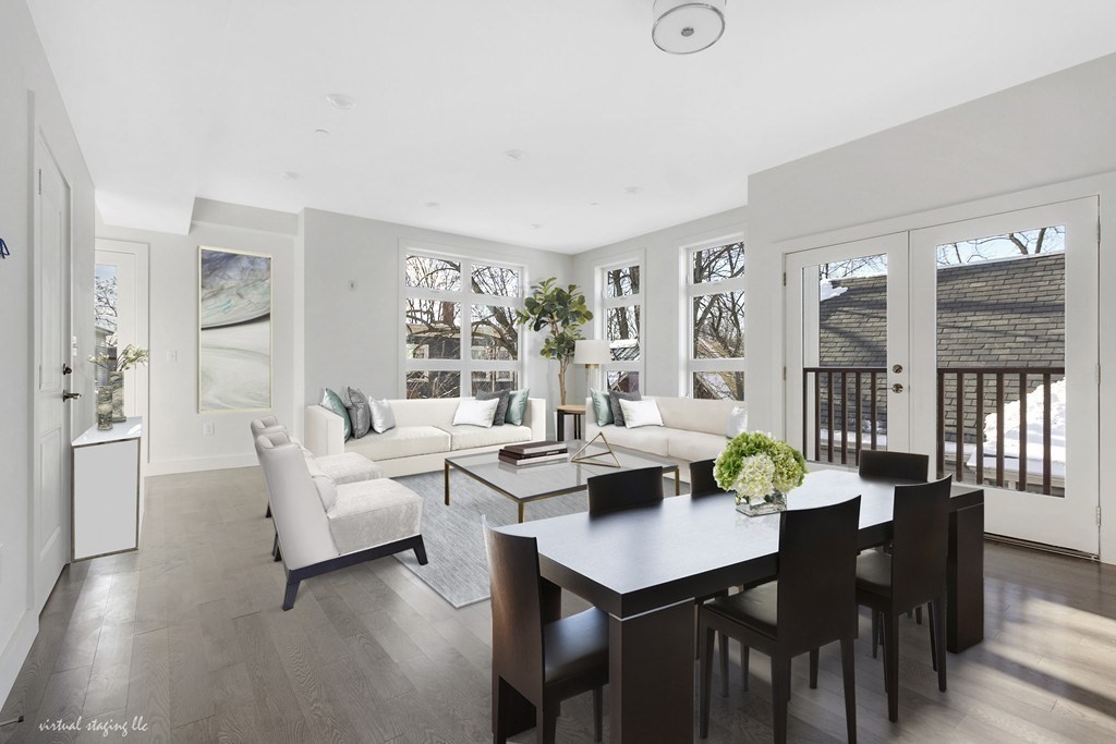 a view of a dining room with furniture and wooden floor