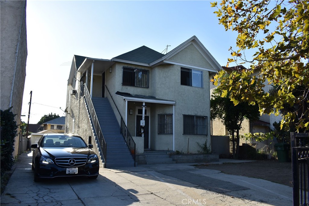 a view of a car parked in front of a house