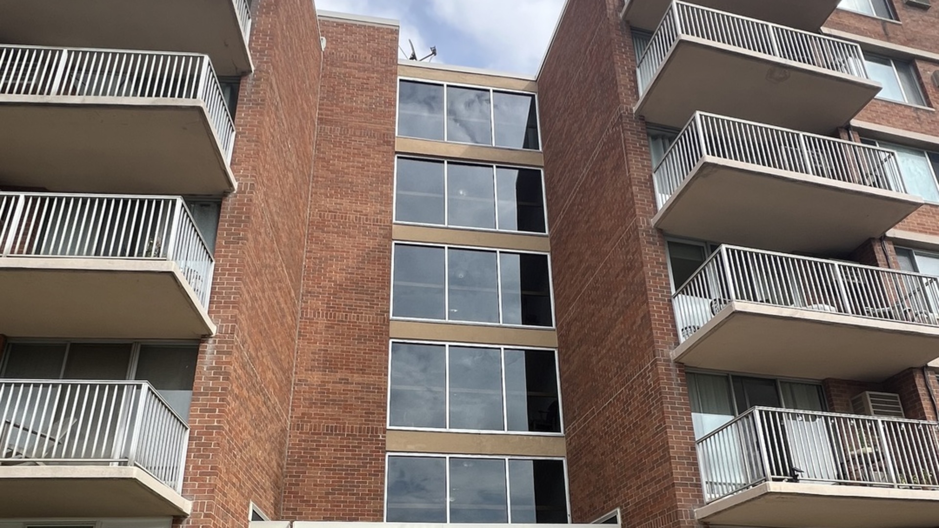 an aerial view of a house with a balcony