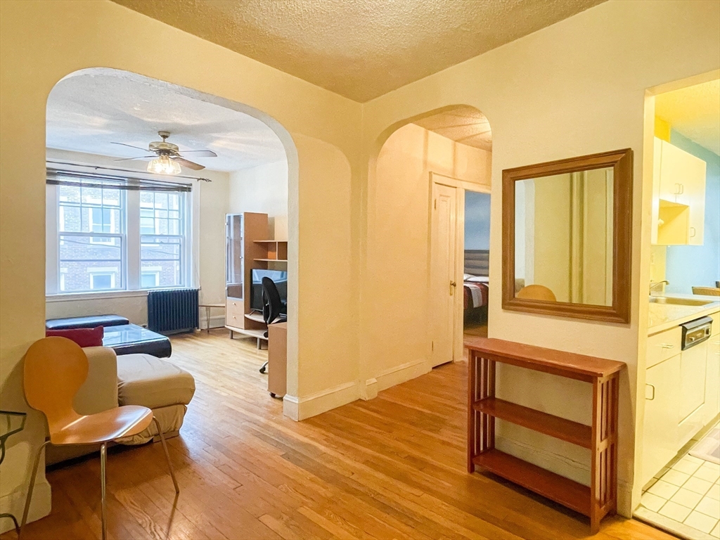 a living room with furniture and a window