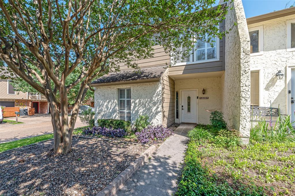 Two story corner unit townhouse in sought after community of Walden on lake Conroe.