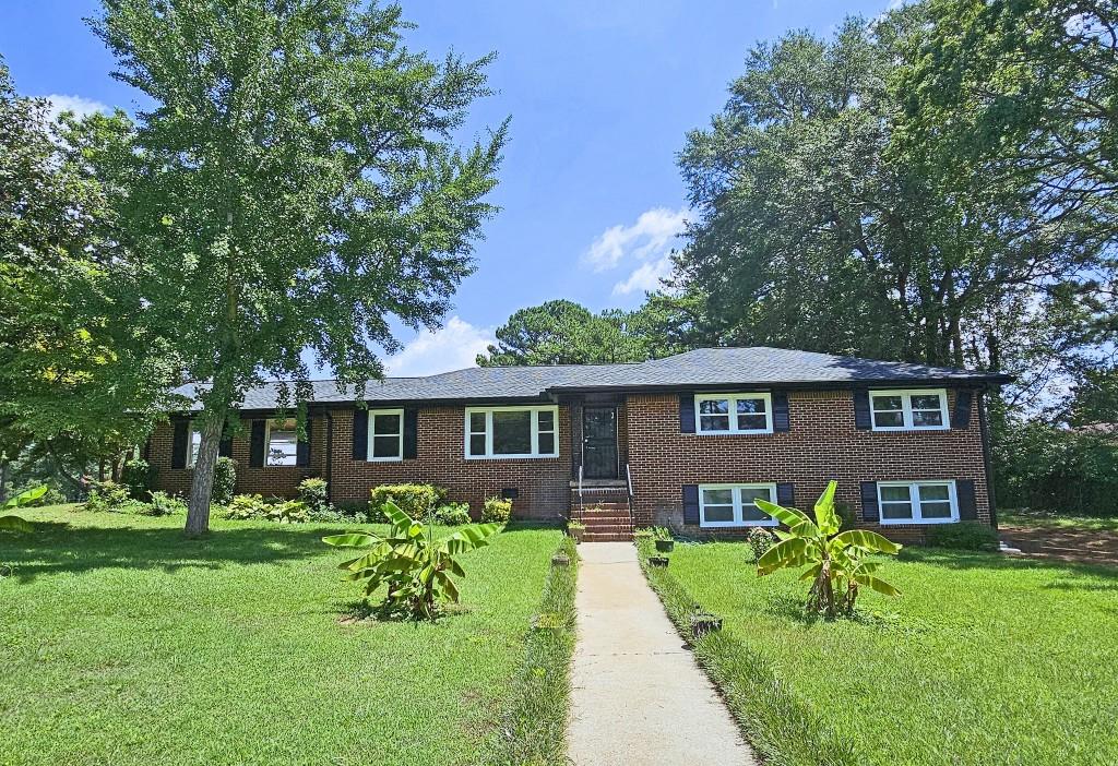 a front view of a house with a yard