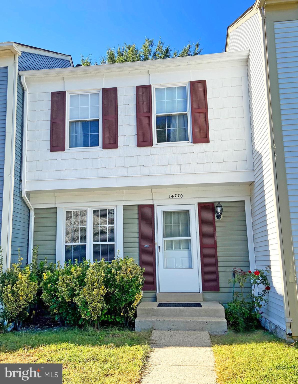 a front view of building with yard