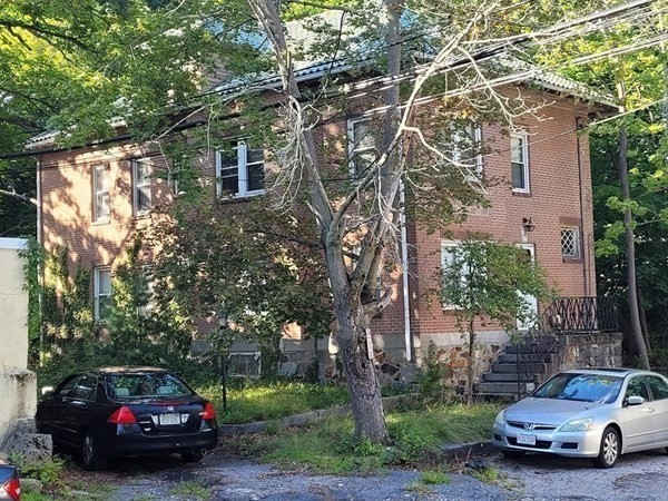 a car parked in front of a house