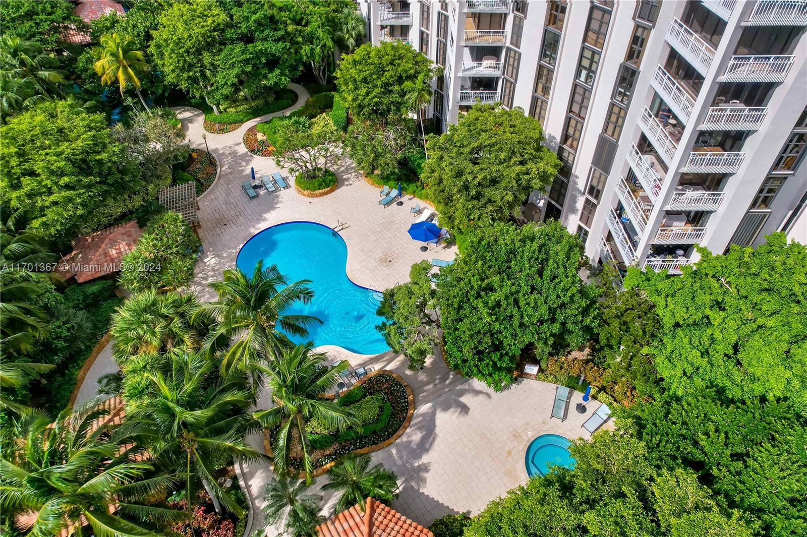 an aerial view of a residential apartment building in a yard