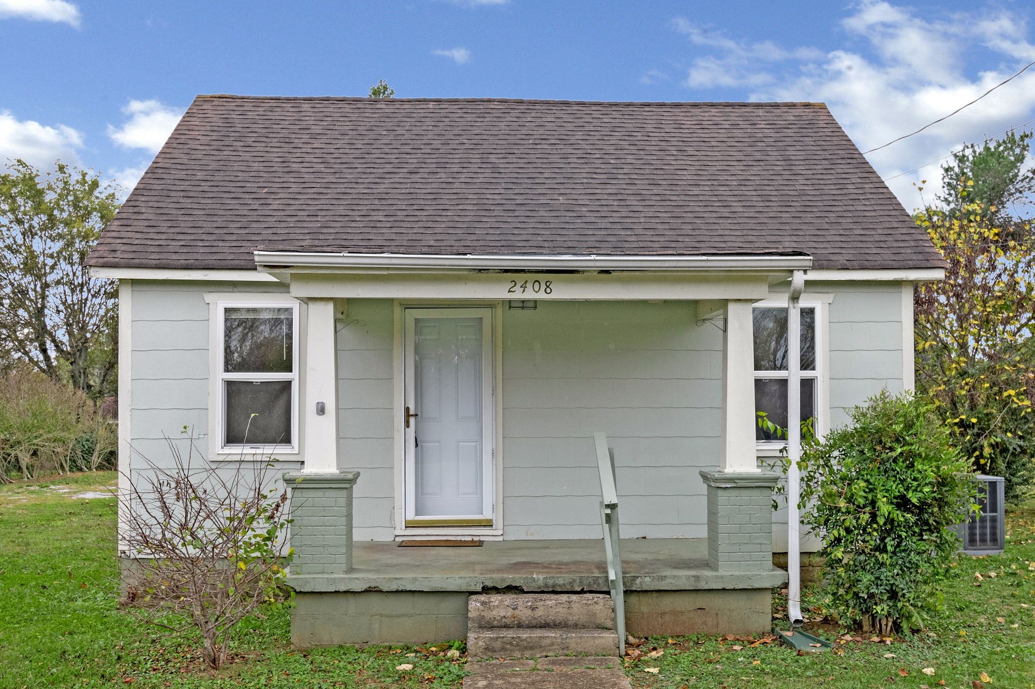 front view of a house with a yard