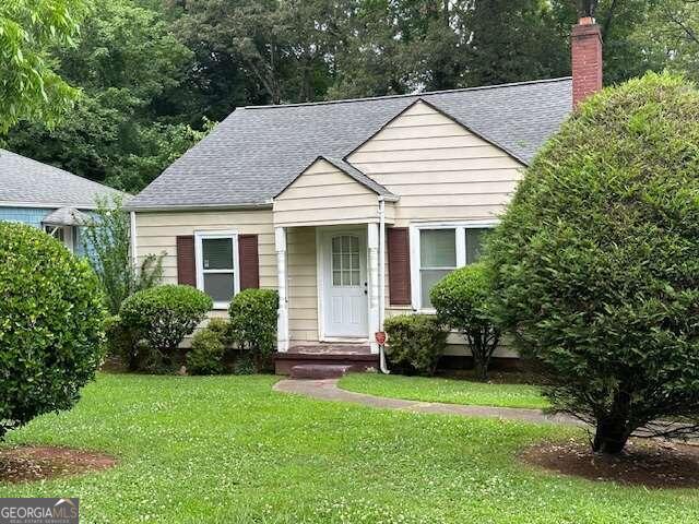 a view of a house with a yard and plants